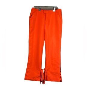Puma bright orange pants.